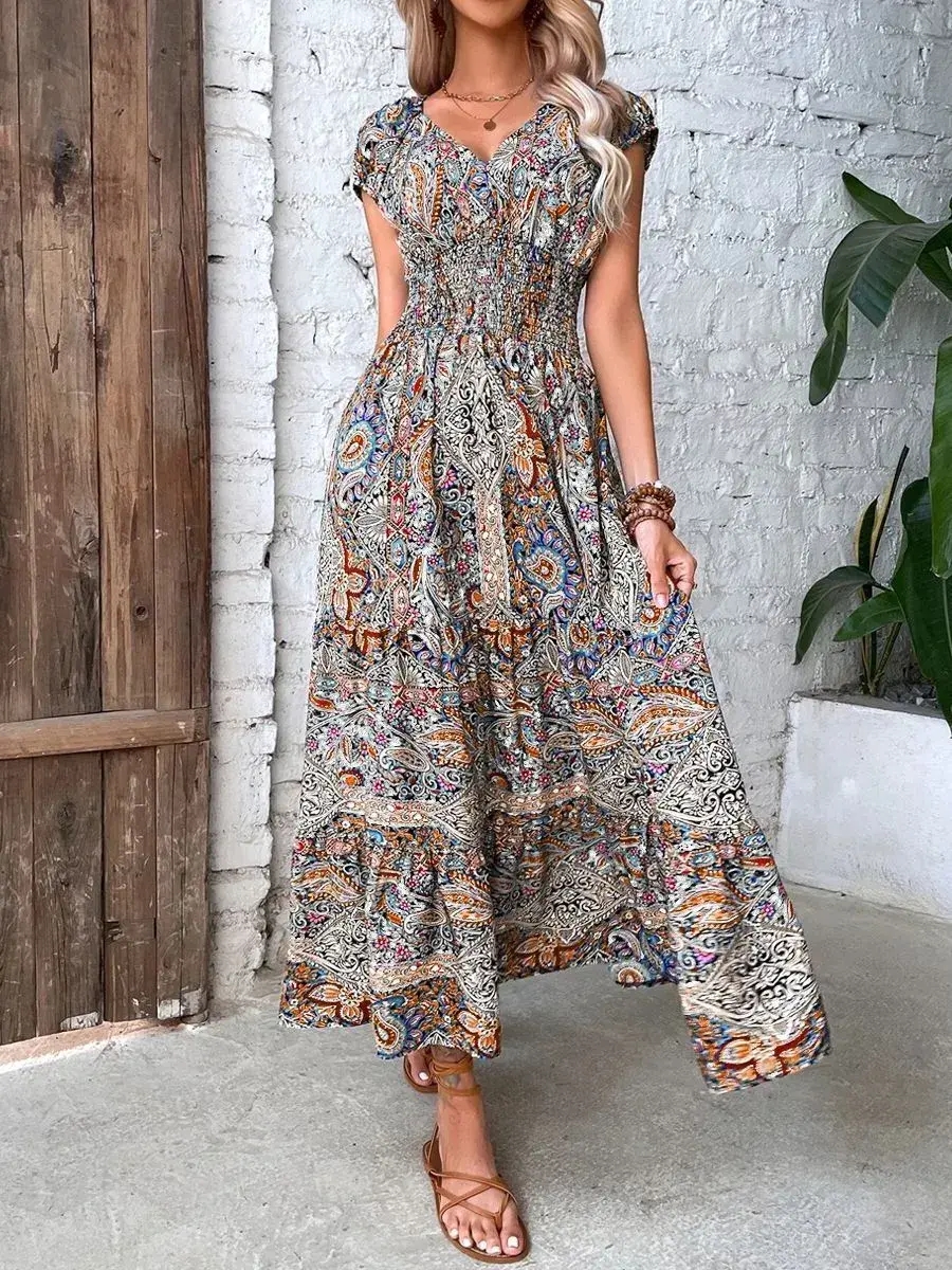Moteriška maxi suknelė V formos iškirpte aukštu liemeniu su boho raštu